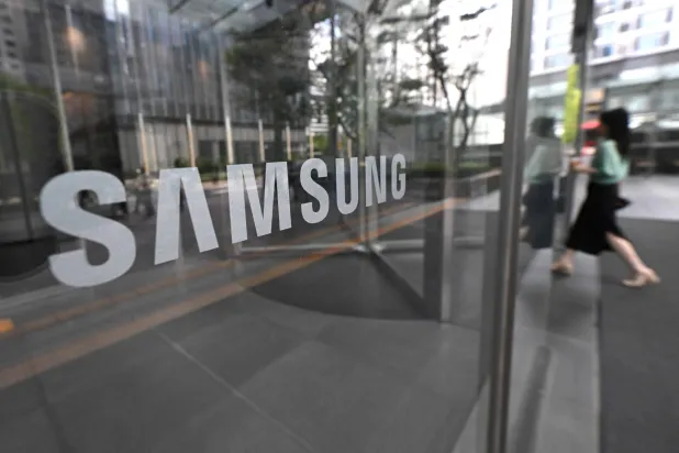The logo of Samsung is seen at the Samsung Electronics Seocho building in Seoul on July 30, 2026. (Photo by Jung Yeon-je / AFP)