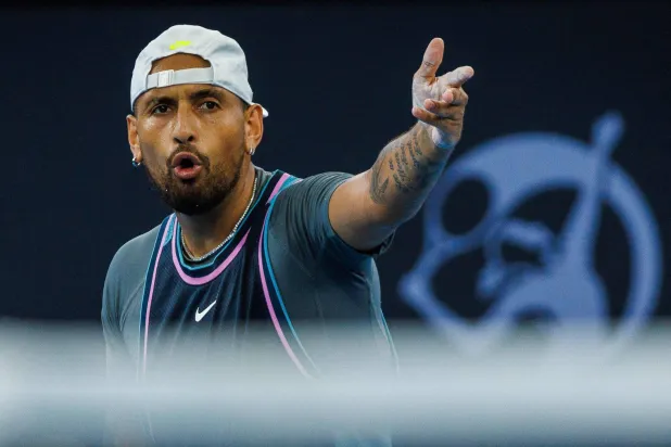 (FILES) Australia's Nick Kyrgios reacts after a point against France's Giovanni Mpetshi Perricard during their men's singles match at the Brisbane International tennis tournament in Brisbane on December 31, 2024. (Photo by Patrick HAMILTON / AFP)