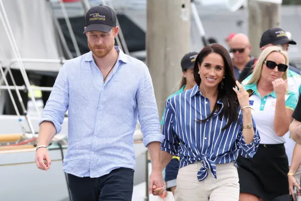 FILE PHOTO: Britain's Prince Harry and Meghan, the Duke and Duchess of Sussex, arrive at Rushcutters Bay following a sail on Sydney Harbour with veterans from the Invictus Australia community, in Sydney, Australia, April 17, 2026. REUTERS/Hollie Adams/File Photo