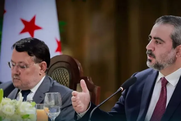 Syrian Foreign Minister Asaad al-Shaibani and presidential media adviser Ahmad Muwafaq Zaidan (SANA) 