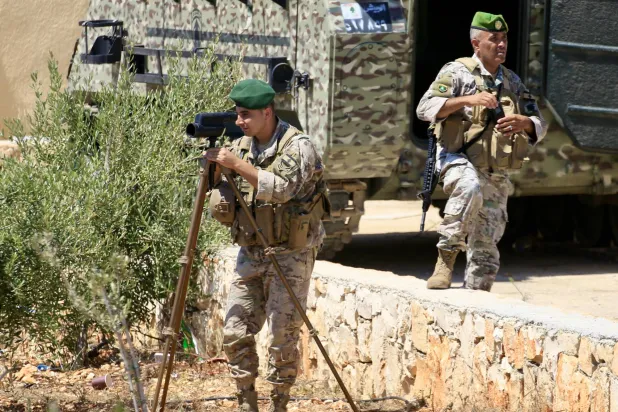 Lebanese Army soldiers monitor the movements of Israeli forces stationed in a neighboring village, in Zawtar al-Gharbiyah, Nabatieh Governorate, southern Lebanon, 31 July 2026, following a US-brokered security agreement between Lebanon and Israel.   EPA/STRINGER