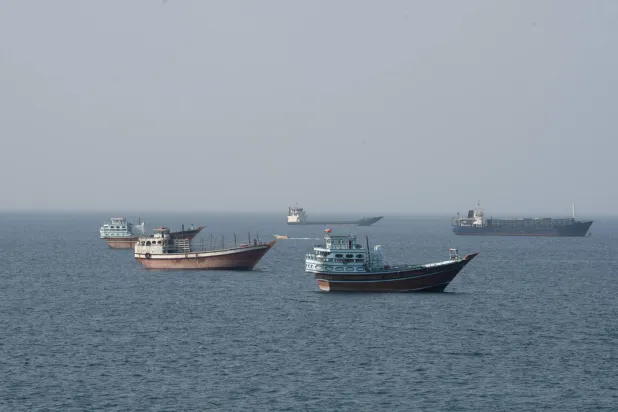 Vessels near the Strait of Hormuz, as seen from Musandam, Oman, August 17, 2026. REUTERS/Stringer