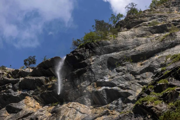 This photo shows the very low flow of the Arpenaz Waterfall, in Sallanches, central-eastern France, on August 12, 2026. (Photo by Alex MARTIN / AFP)