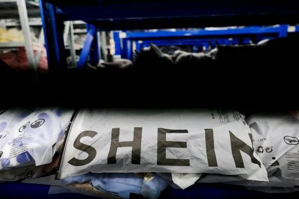 FILE PHOTO: Packs of clothing are displayed at a garment factory for Shein in Panyu District, Guangzhou, Guangdong province, China, July 27, 2026. REUTERS/Go Nakamura/File Photo