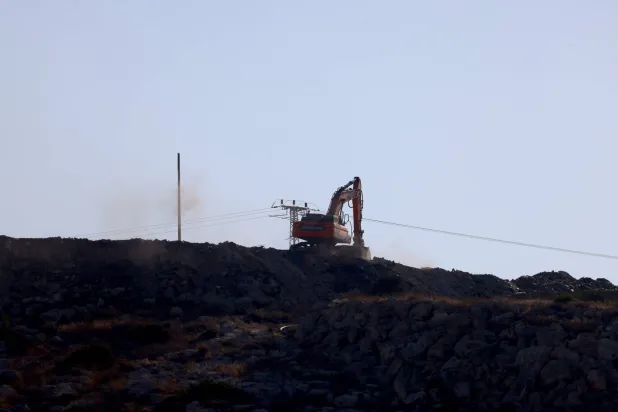 A bulldozer prepares roads at the site of the former Israeli settlement of Kadim near the West Bank city of Jenin, 19 August 2026. EPA/ALAA BADARNEH