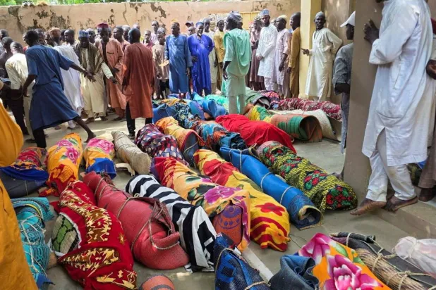 Bodies of victims of a boat accident lie in the forecourt of a community mosque ahead of their burial in Gorau, Sokoto State, Nigeria, August 20, 2026. Picture taken with a mobile phone. REUTERS/Abubakar Imam