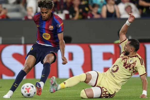 Barcelona's Spanish forward Lamine Yamal will lead a new-look attacking line for the champions. Lluis GENE / AFP
