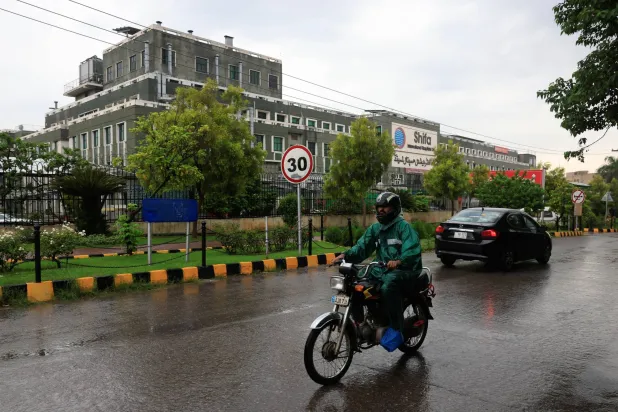  A man on a motorbike rides past the Shifa International Hospital, after jailed former Prime Minister Imran Khan was moved back to prison after spending a few hours overnight at the hospital, in Islamabad, Pakistan, August 21, 2026. (Reuters)