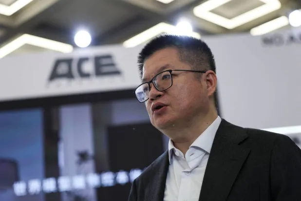 Wang Xiaogang, co-founder of SenseTime and chairman of ACE Robotics, speaks during an interview with Reuters at the booth of ACE Robotics, during the 2026 World Robot Conference, in Beijing, China, August 21, 2026. REUTERS/Tingshu Wang