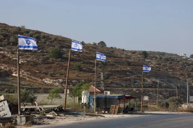  Israeli flags raised by settlers as seen on a main road to Jenin City, 21 August 2026. (EPA)