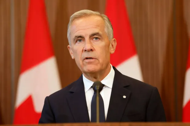  Prime Minister Mark Carney speaks about Canada's response to new US tariffs during a news conference on Parliament Hill in Ottawa on Saturday, Aug. 22, 2026. (Patrick Doyle/The Canadian Press via AP) 
