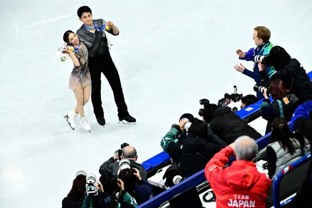 (FILES) Gold medallists Japan's Riku Miura and Ryuichi Kihara pose after the victory ceremony of the figure skating pair skating free skating final during the Milano Cortina 2026 Winter Olympic Games at Milano Ice Skating Arena in Milan on February 16, 2026. (Photo by JULIEN DE ROSA / AFP)