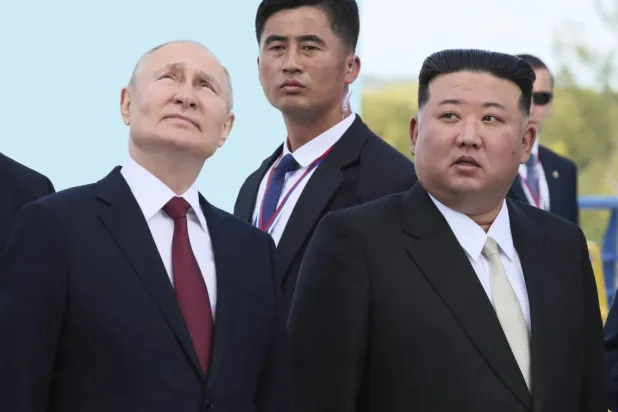 FILE - Russian President Vladimir Putin, left, and North Korea's leader Kim Jong Un examine a launch pad of Soyuz rockets during their meeting at the Vostochny cosmodrome outside the city of Tsiolkovsky, about 200 kilometers from the city of Blagoveshchensk in the far eastern Amur region, Russia, on Wednesday, Sept. 13, 2023. (Mikhail Metzel, Sputnik, Kremlin Pool Photo via AP, File)
