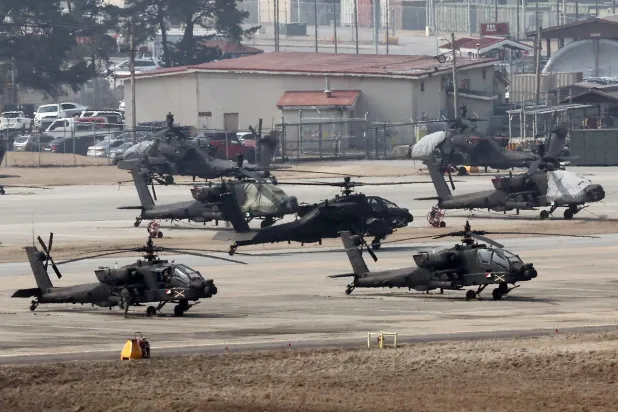 Apache choppers take off at Camp Humphreys in Pyeongtaek, South Korea, 04 March 2024, to join the Freedom Shield 2024 exercise on the first day of the 11-day annual South Korea-US joint drill against North Korean provocations.  EPA/YONHAP