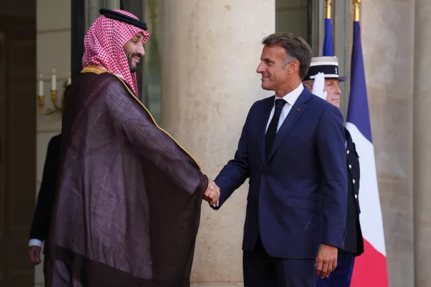 France's President Emmanuel Macron, right, greets Saudi Crown Prince Mohammed bin Salman before a meeting at the Elysee Palace in Paris, France, Monday Aug. 24, 2026. (AP Photo/Aurelien Morissard)