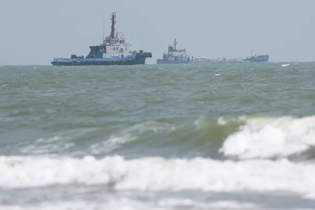 Vessels in the Strait of Hormuz are visible near the beach of Bandar Abbas, Iran, August 25, 2026. Majid Asgaripour/WANA (West Asia News Agency) via REUTERS