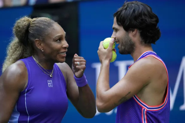 USA's Serena Williams and Spain's Carlos Alcaraz confer during their mixed doubles tennis match against Switzerland's Belinda Bencic and Italy's Flavio Cobolli at the 2026 US Open tennis tournament at the USTA Billie Jean King National Tennis Center in New York, on August 25, 2026. (AFP) 
