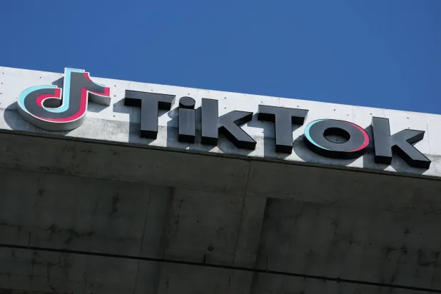 The TikTok logo is displayed on signage outside TikTok social media app company offices in Culver City, California on September 30, 2025. (AFP)