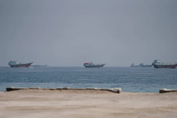 Vessels near the Strait of Hormuz, as seen from Musandam, Oman, August 24, 2026. (Reuters)