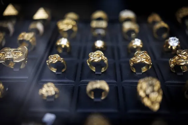 Gold jewellery is displayed at a gold dealer shop window in Hatton Garden, London, Britain, 25 August 2026. (EPA) 