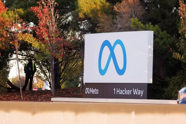 A security guard stands watch by the Meta sign outside the headquarters of Facebook parent company Meta Platforms Inc in Mountain View, California, US, November 9, 2022. (Reuters)