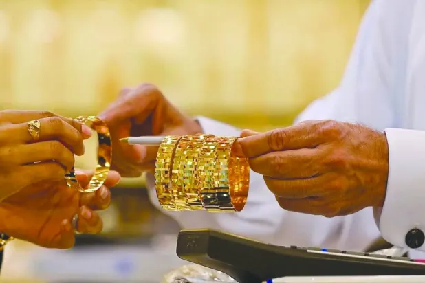A customer looks at gold bracelets at a local store in Saudi Arabia (SPA)