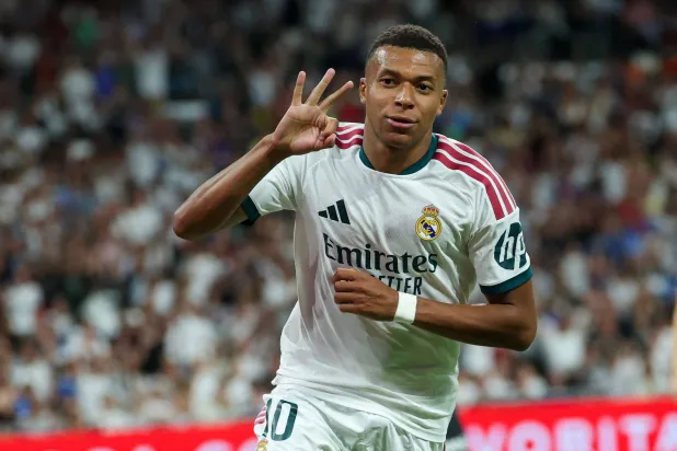 Real Madrid's French forward #10 Kylian Mbappe celebrates scoring a hat-trick and his team's fourth goal during the Spanish league football match between Real Madrid CF and Real Sociedad at Santiago Bernabeu Stadium in Madrid on August 26, 2026. (AFP)