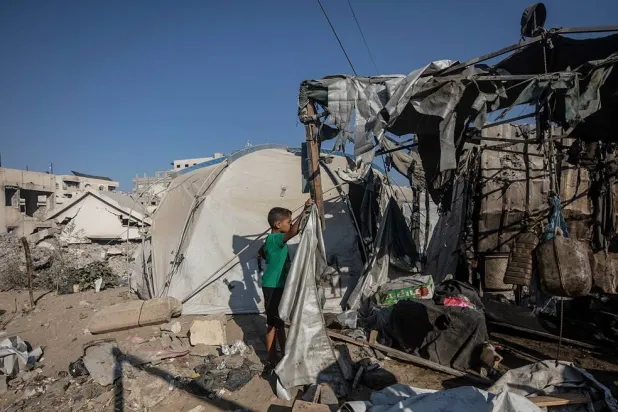 Palestinians inspect the damage following an Israeli airstrike in Gaza City, Gaza Strip, 27 August 2026. (EPA)