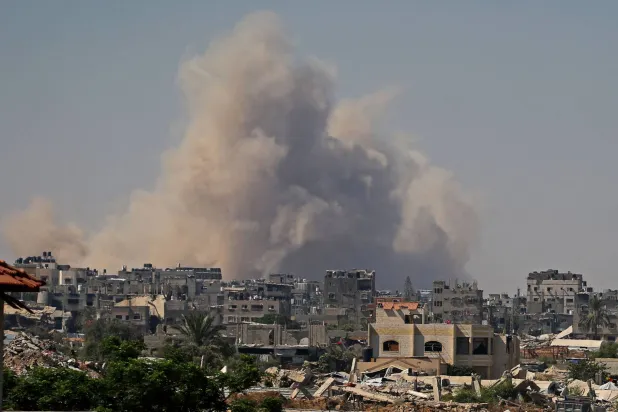 Smoke billows following Israeli demolition of residential structures east of Deir al-Balah in the central Gaza Strip on August 25, 2026. (AFP)