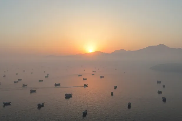 A drone view shows vessels in the Strait of Hormuz, as seen from Musandam, Oman, June 15, 2026. (Reuters)
