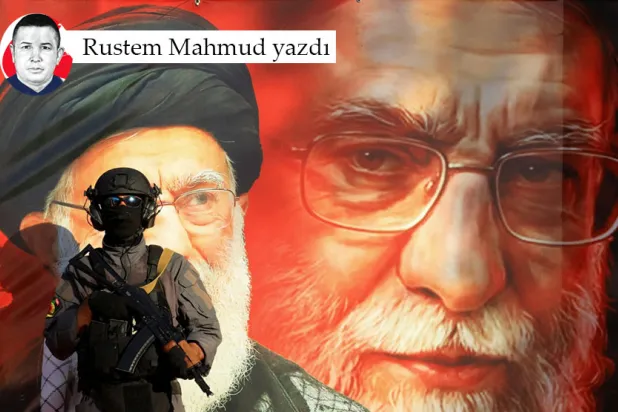 Bağdat'ta İran Büyükelçiliği yakınlarında İran'la dayanışma amacıyla düzenlenen bir yürüyüş sırasında, İran Dini Lideri Ali Hamaney'in tasvir edildiği bir duvar resminin önünde nöbet tutan Seyyid’uş-Şuheda Tugaylarının bir üyesi, 19 Haziran 2026 (Reuters)