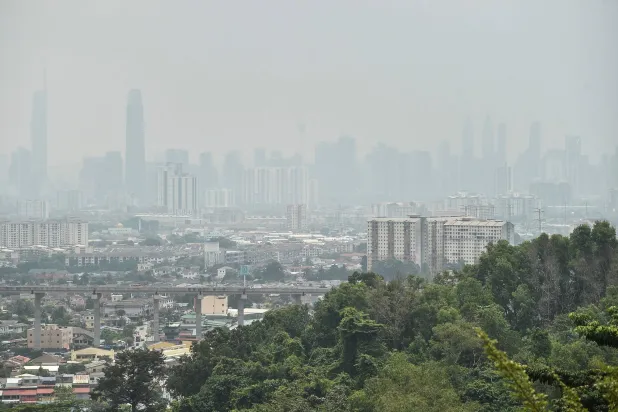 Haze shrouds the Kuala Lumpur skyline on August 26, 2026, amid high levels of air pollution from regional wildfires. (AFP)