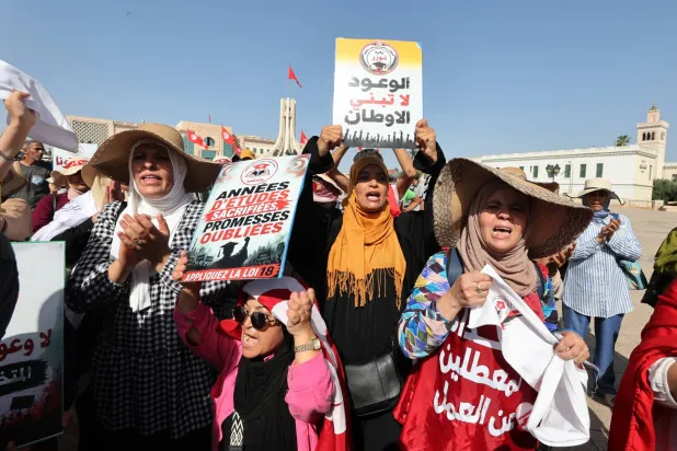 جانب من المظاهرة المطالِبة بتطبيق قانون توظيف العاطلين «إ.ب.أ»