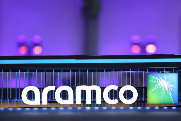 The logo of Saudi Aramco is seen during the Adopt AI International Summit at the Grand Palais in Paris, France, November 26, 2025. (Reuters)