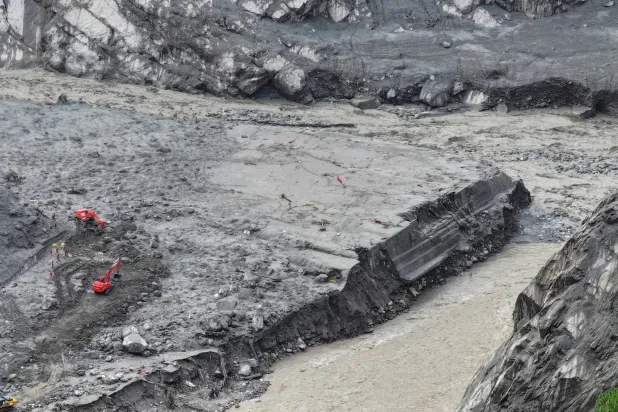 This aerial photo shows rescuers at the site of the Gyirong Port, which was destroyed by a mudslide on August 26, in Gyirong County, in China's western Tibet region on September 2, 2026. (CNS / AFP)