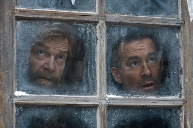 This image released by Apple TV shows Kenneth Branagh, left, and Ryan Reynolds in a scene from "Mayday." (Apple TV via AP) 