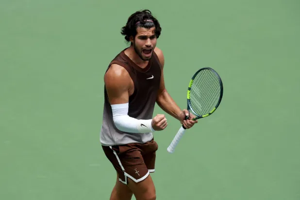 NEW YORK - AUGUST 31: Carlos Alcaraz of Spain celebrates a point against Roman Safiullin during their Men's Singles First Round match on Day Two of the 2026 US Open at USTA Billie Jean King National Tennis Center on August 31, 2026 in the Flushing neighborhood of the Queens borough of New York City.   Clive Brunskill/Getty Images/AFP 