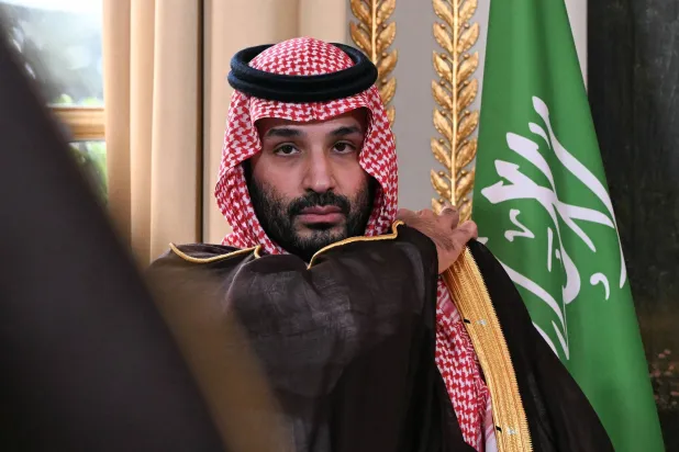 Saudi Arabia's Crown Prince Mohammed bin Salman looks on as he attends a trade agreement signature ceremony at the Elysee Palace in Paris, France, August 24, 2026.     Lou Benoist/Pool via REUTERS