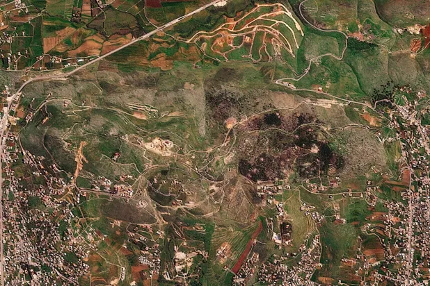 A satellite image shows damage at the Ali al-Taher ridge near Nabatiah, Lebanon, March 8, 2026. 2026 (Planet Labs PBC/Handout via Reuters)