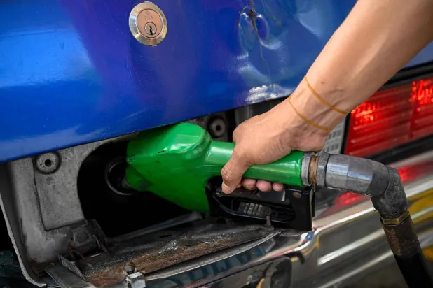 A worker refuels a car at a gas station in Caracas on September 3, 2026. (AFP)