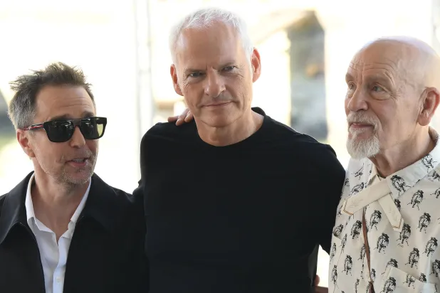 Actors John Malkovich (R) and Sam Rockwell (L) with director Martin McDonagh (C) arrive at the Lido Beach for the Venice International Film Festival, in Venice, Italy, 03 September 2026. (EPA)