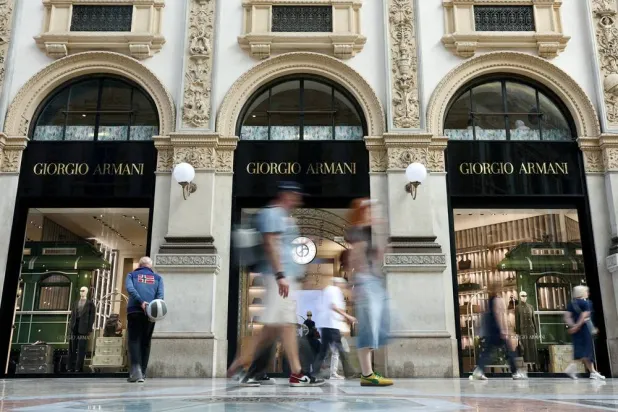 People walk past a Giorgio Armani store in Galleria Vittorio Emanuele II, in Milan, Italy, September 5, 2025. (Reuters)