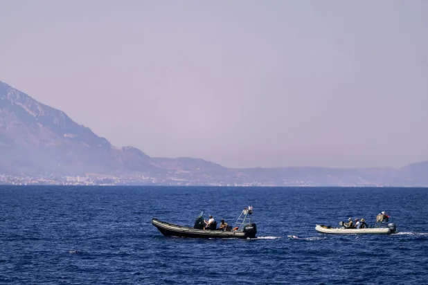 Motor boats take part in a search operation for people missing two days after a ferry disaster off the coast of Cyprus, near the port of Kyrenia in the Turkish-occupied northern part of Cyprus, Tuesday, Sept. 1, 2026. (AP)