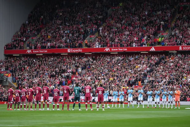 Liverpool and Nottingham Forest players observe a minute applause for Kevin Keegan the English Premier League soccer match between Liverpool and Nottingham Forest in Liverpool, England, Saturday, Aug. 29, 2026. (AP Photo/Jon Super)