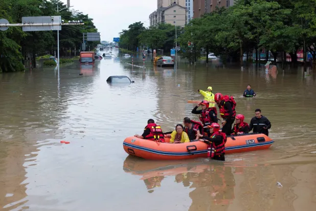 A drone view shows rescue workers evacuating flood-affected residents by boat after heavy rainfall from Typhoon Saudel, in Putian, Fujian province, China September 4, 2026. (China Daily via Reuters)