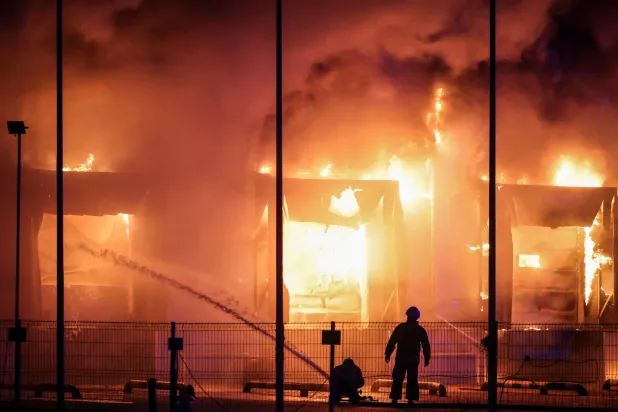  Firefighters work at the site of a warehouse hit by a Russian drone strike, amid Russia's attack on Ukraine, in Kyiv region, Ukraine, September 4, 2026. (Reuters)