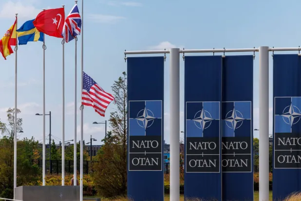 The US flag is lowered to half staff to honor country music legend Dolly Parton following her passing, at the North Atlantic Treaty Organization (NATO) headquarters, in Brussels, Belgium, 27 August 2026. (EPA)