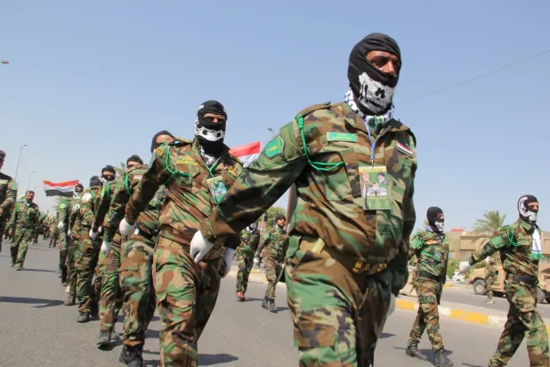 عناصر من «الحشد الشعبي» يشاركون في عرض عسكري في بغداد (أرشيفية - غيتي)