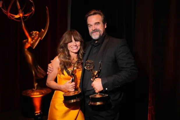 Linda Cardellini, left, and David Harbour with their Emmys for Outstanding Supporting Actor in a Limited or Anthology Series or Movie for "DTF St. Louis" during night two of the Television Academy's 78th Emmy Awards at the Peacock Theater at L.A. LIVE on Sunday, Sept. 6, 2026 in Los Angeles. (Jordan Strauss/Invision for the Television Academy/AP) 