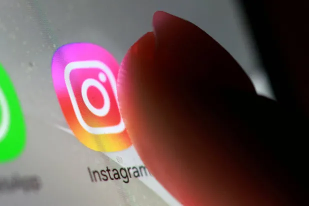 The Instagram app icon is seen on a smartphone in this illustration taken October 27, 2025. (Reuters)